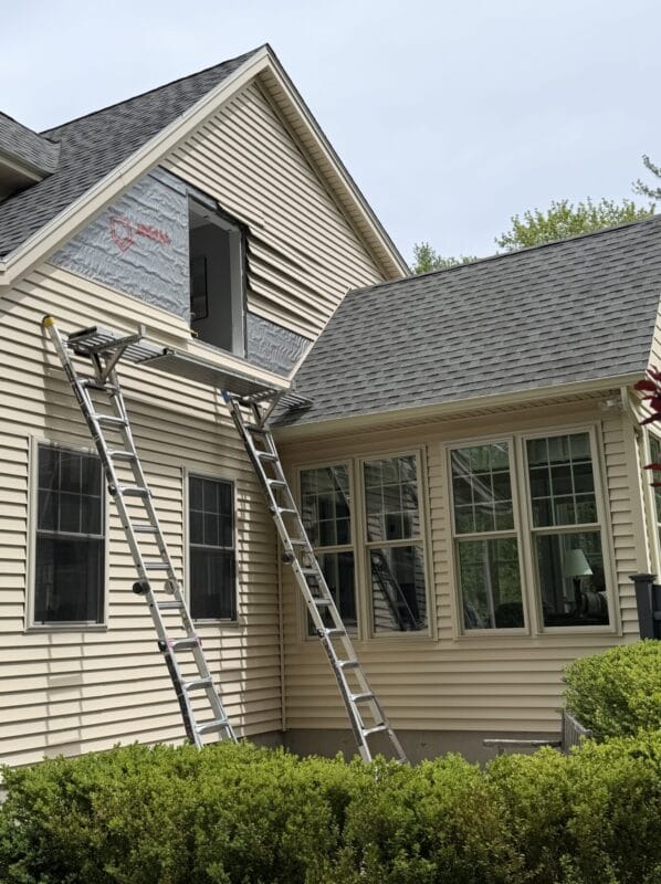 Window replacement installation in progress at Ogunquit, Maine home with existing window removed and exterior waterproofing preparation completed by Best Choice Windows & Doors